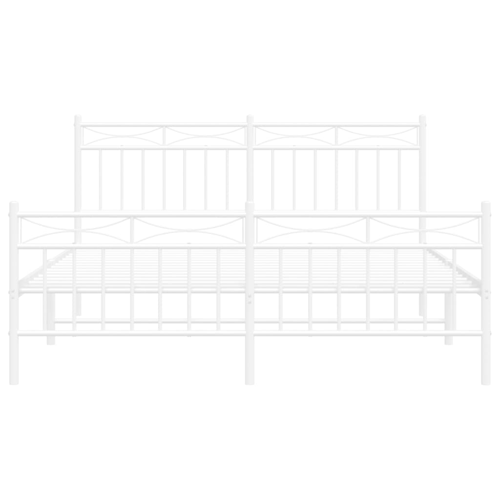 White metal bed frame with mattress and decorative headboard