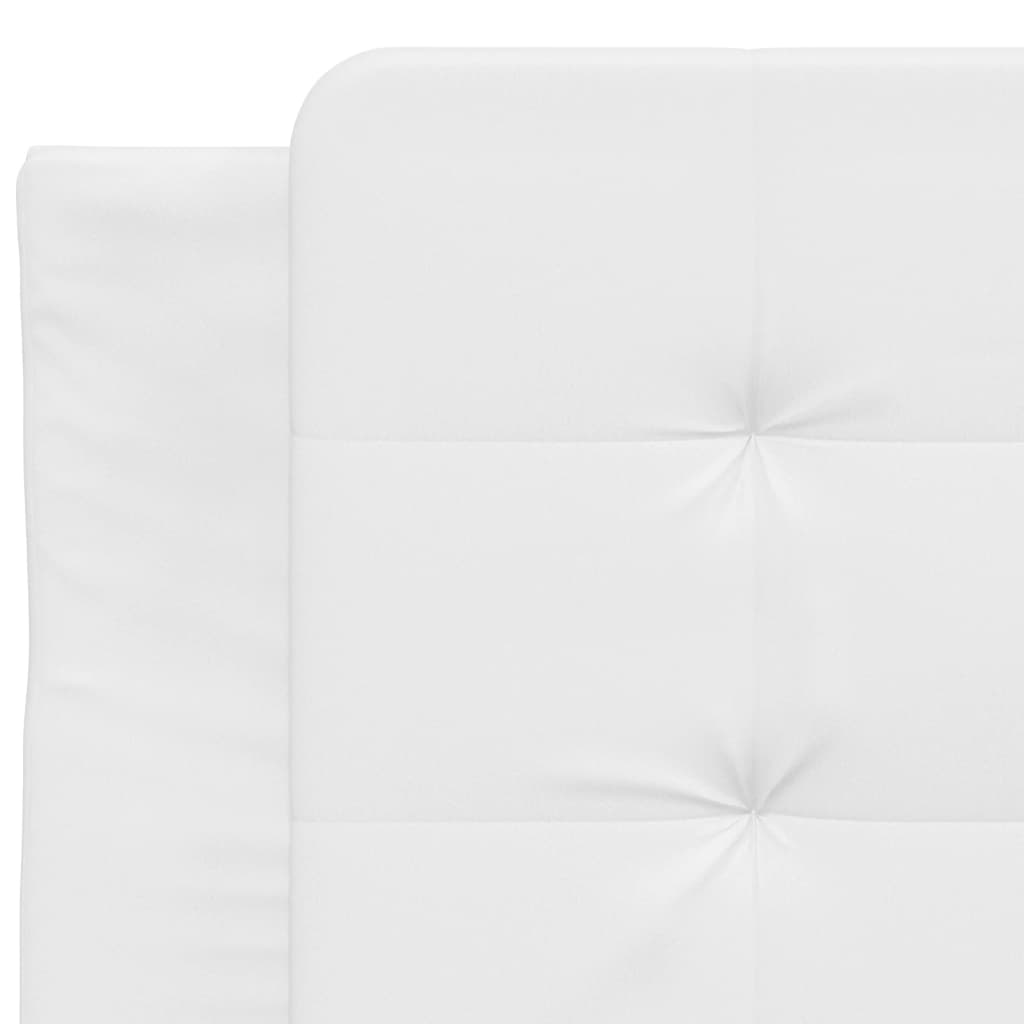 Closeup of white textured bed frame with black cylindrical legs