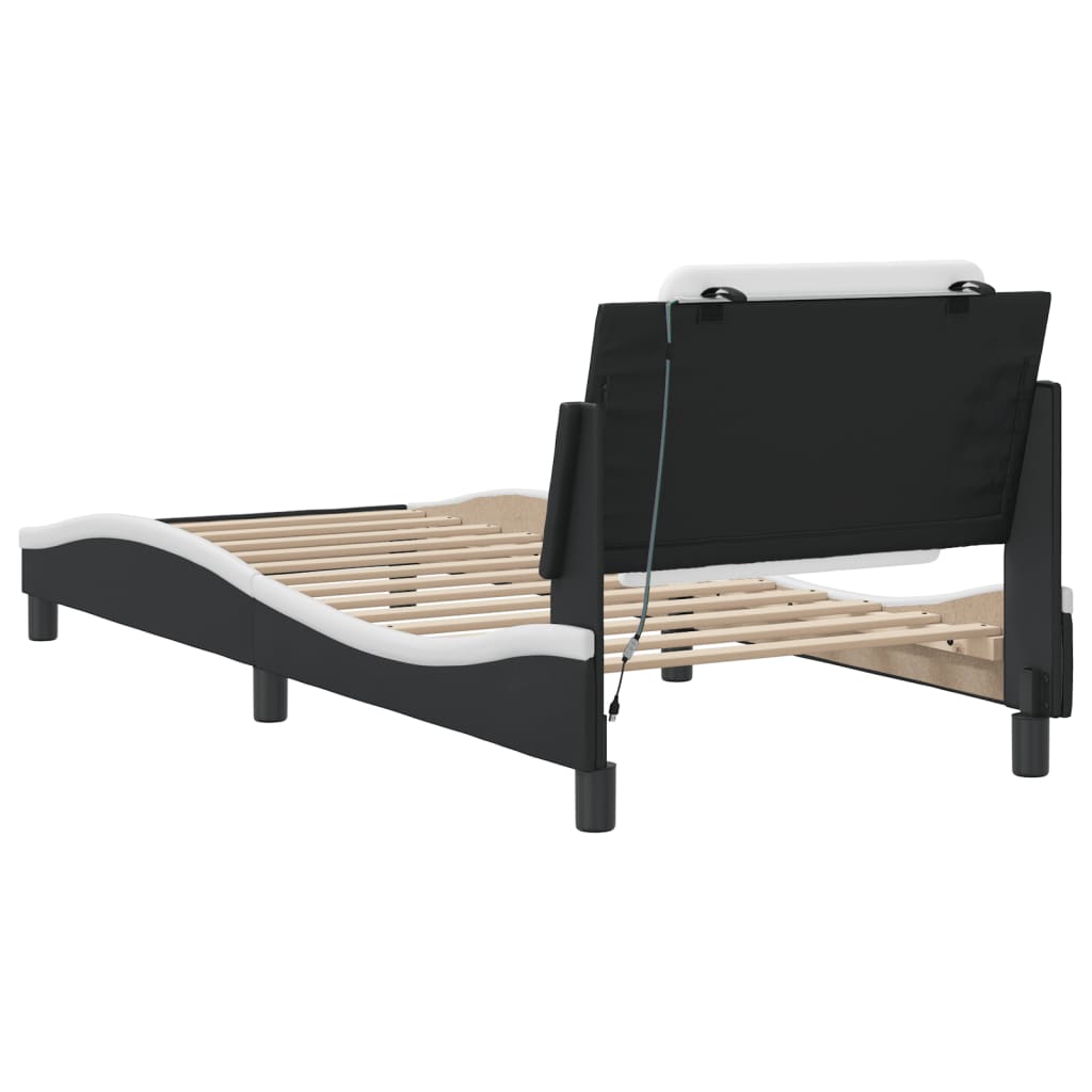 Modern black and white upholstered bed frame with adjustable headboard and slatted base