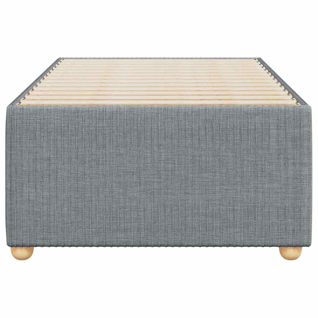 Grey fabric upholstered divan bed base with wooden slats and round legs