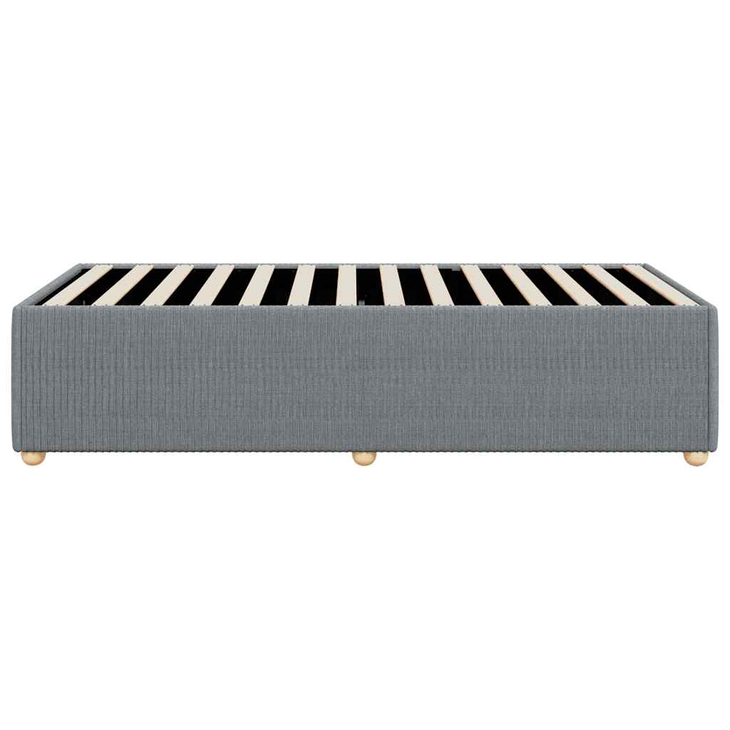 Grey upholstered divan bed base with wooden slats and round feet