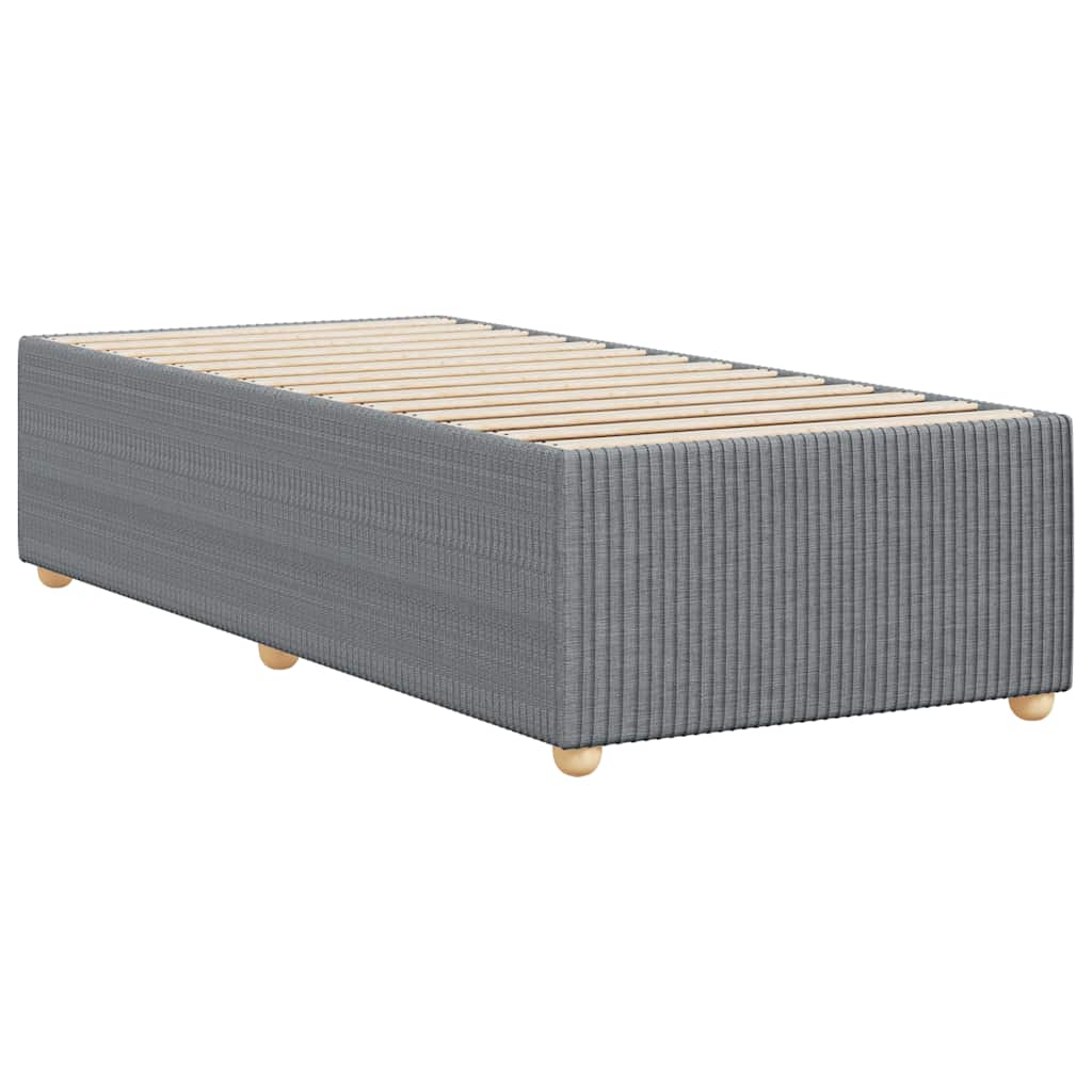 Grey fabric bed frame with wooden slats and short wooden legs