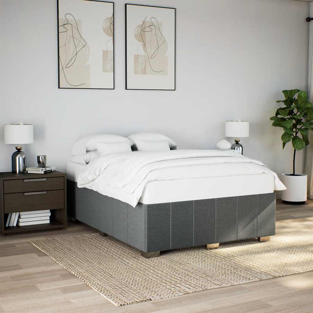 Modern grey divan bed with white linens and two pillows