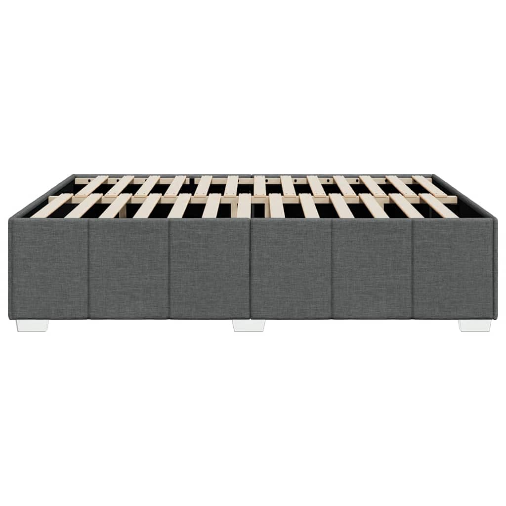 Upholstered grey bed frame with wooden slatted base and modern legs