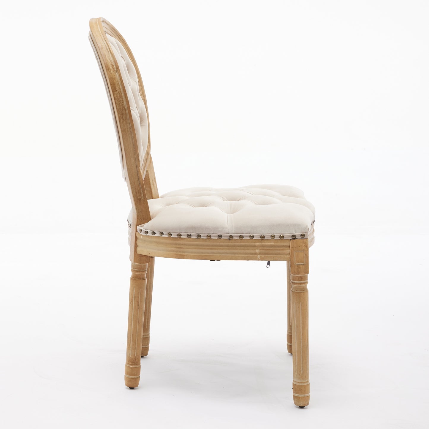 Tufted cream fabric dining chair with natural wood frame and ornate legs