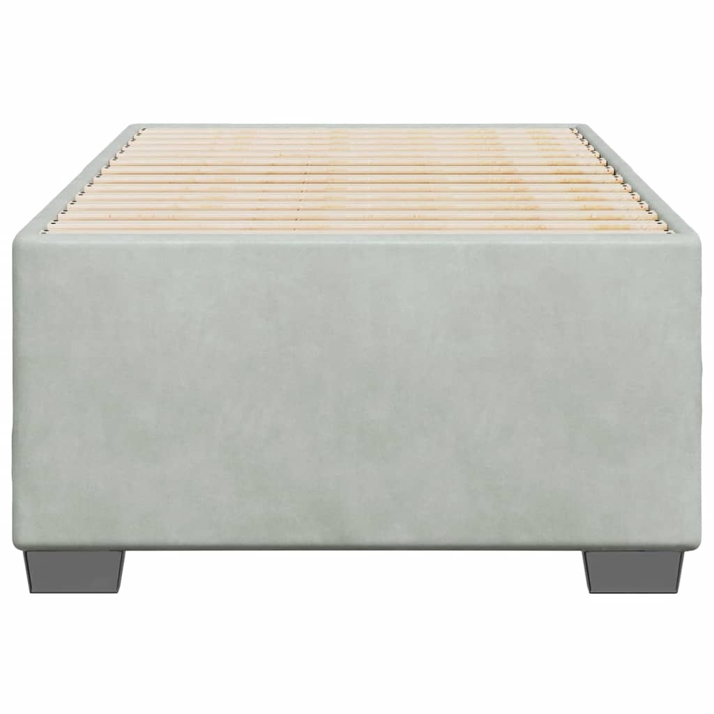Light gray upholstered twin bed frame with wooden slats