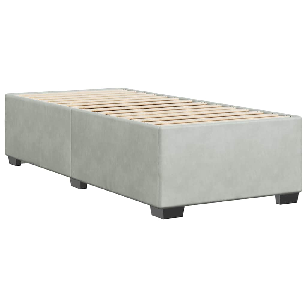 Light gray upholstered platform bed frame with wooden slats