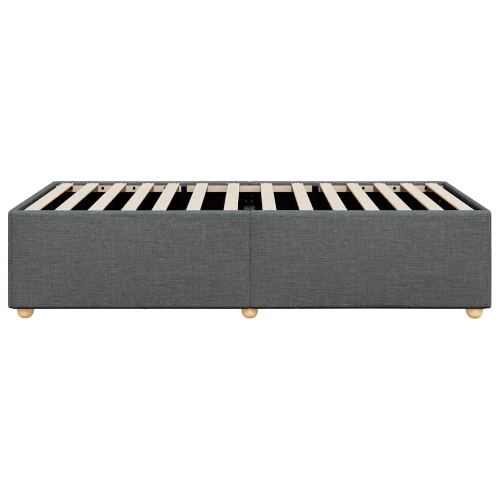 Charcoal gray upholstered bed base with wooden slats and round legs