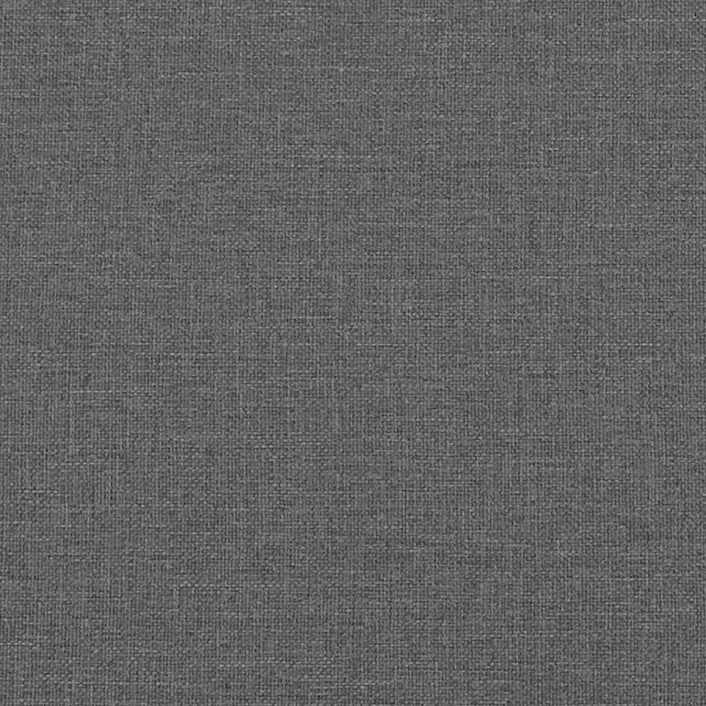 Closeup of a dark grey upholstered bed frame with wooden slats for mattress support