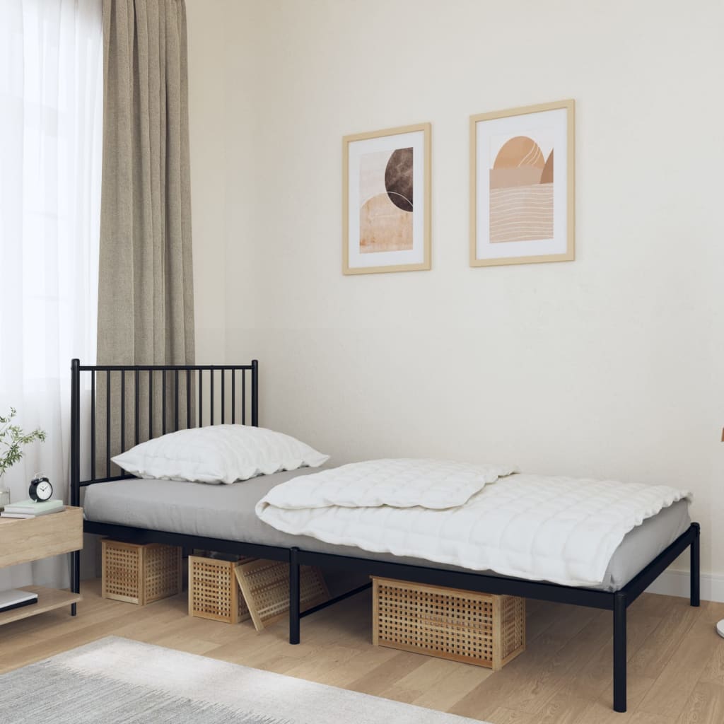 Black metal twin bed frame with vertical slat headboard and footboard