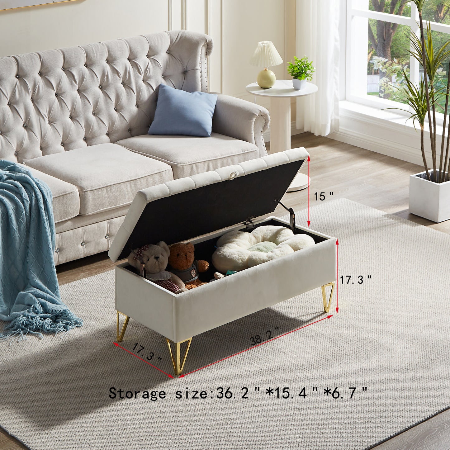 Cream velvet storage ottoman with gold legs and plush interior