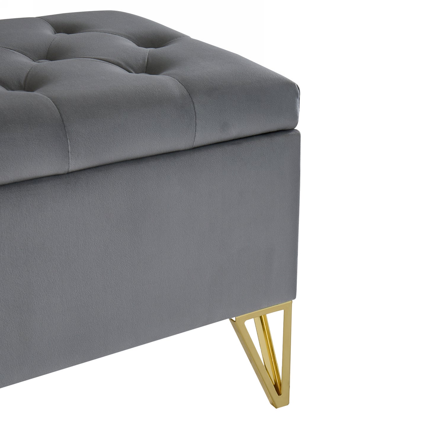 Gray velvet storage ottoman with tufted lid and gold angled legs