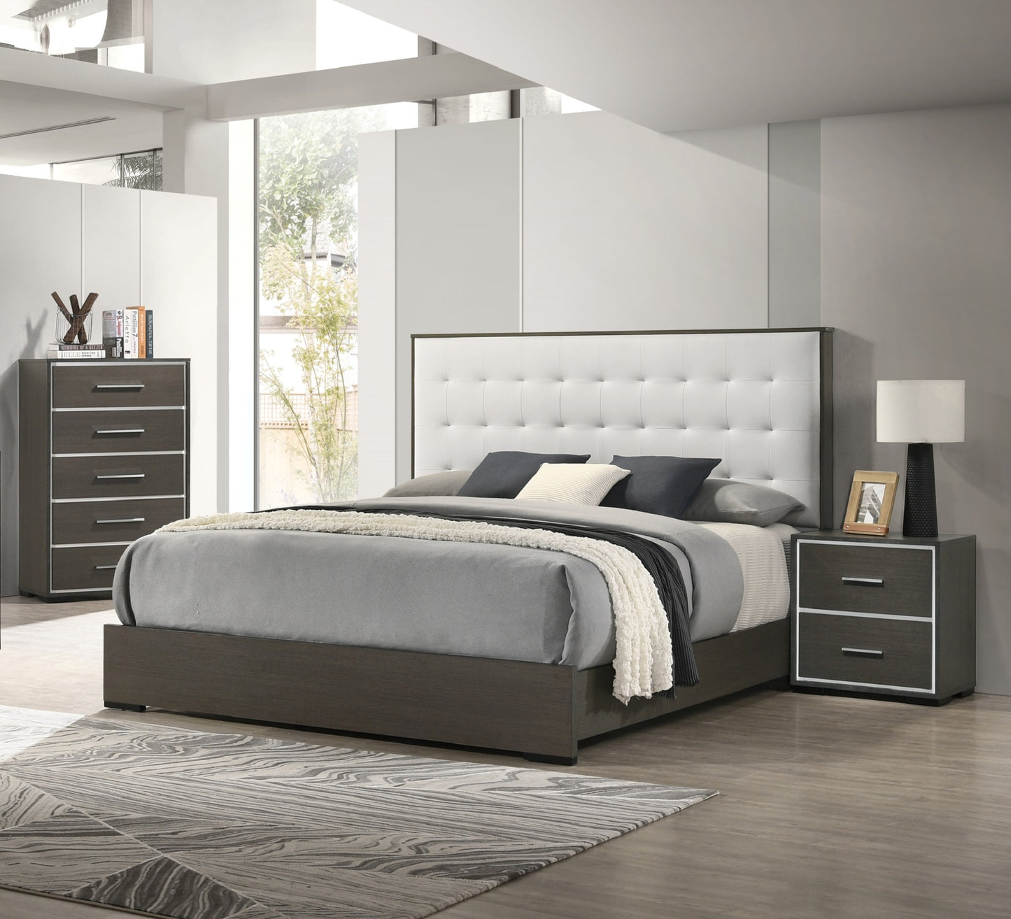 Tufted white upholstered headboard with dark wood frame bed
