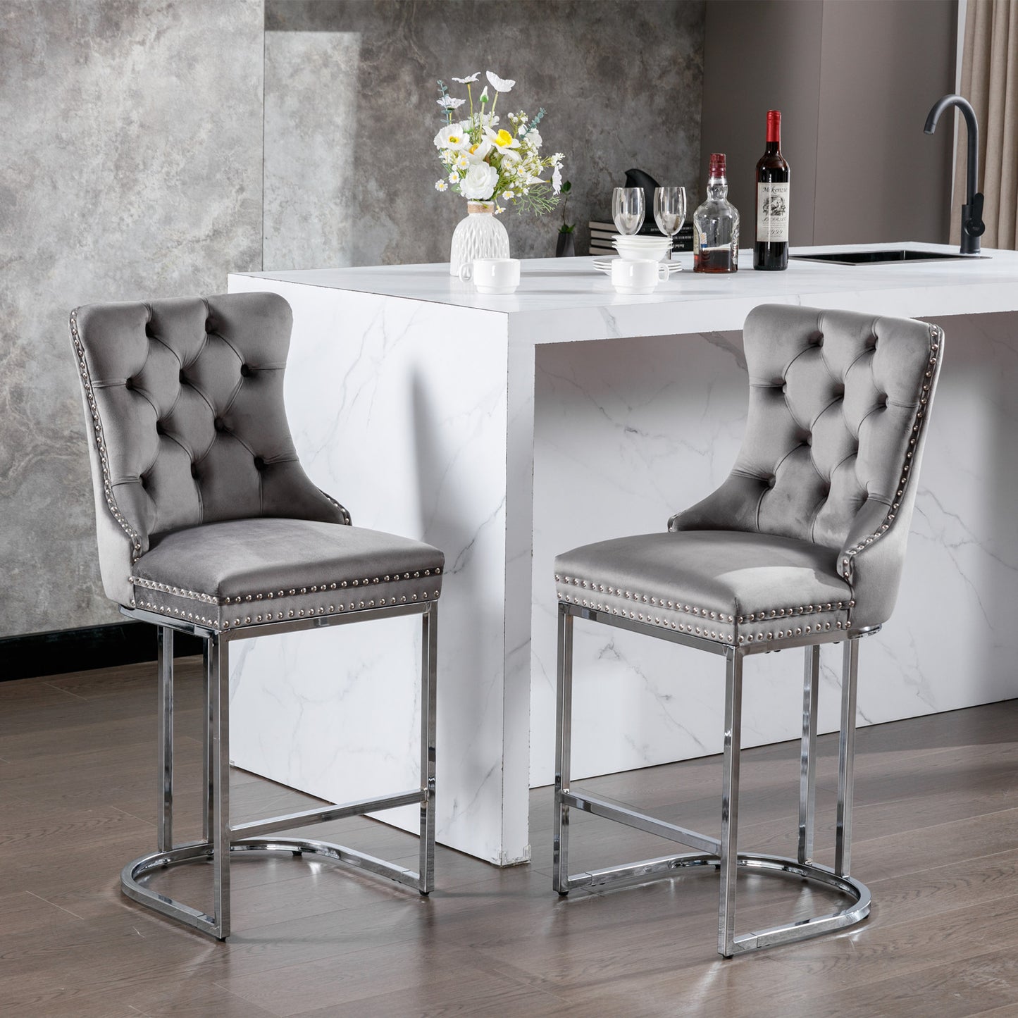 Grey velvet tufted bar stool with silver nailhead trim and chrome legs