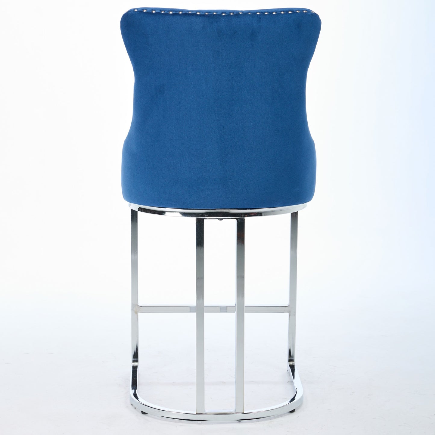 Deep blue velvet bar stool with polished chrome base and nailhead trim