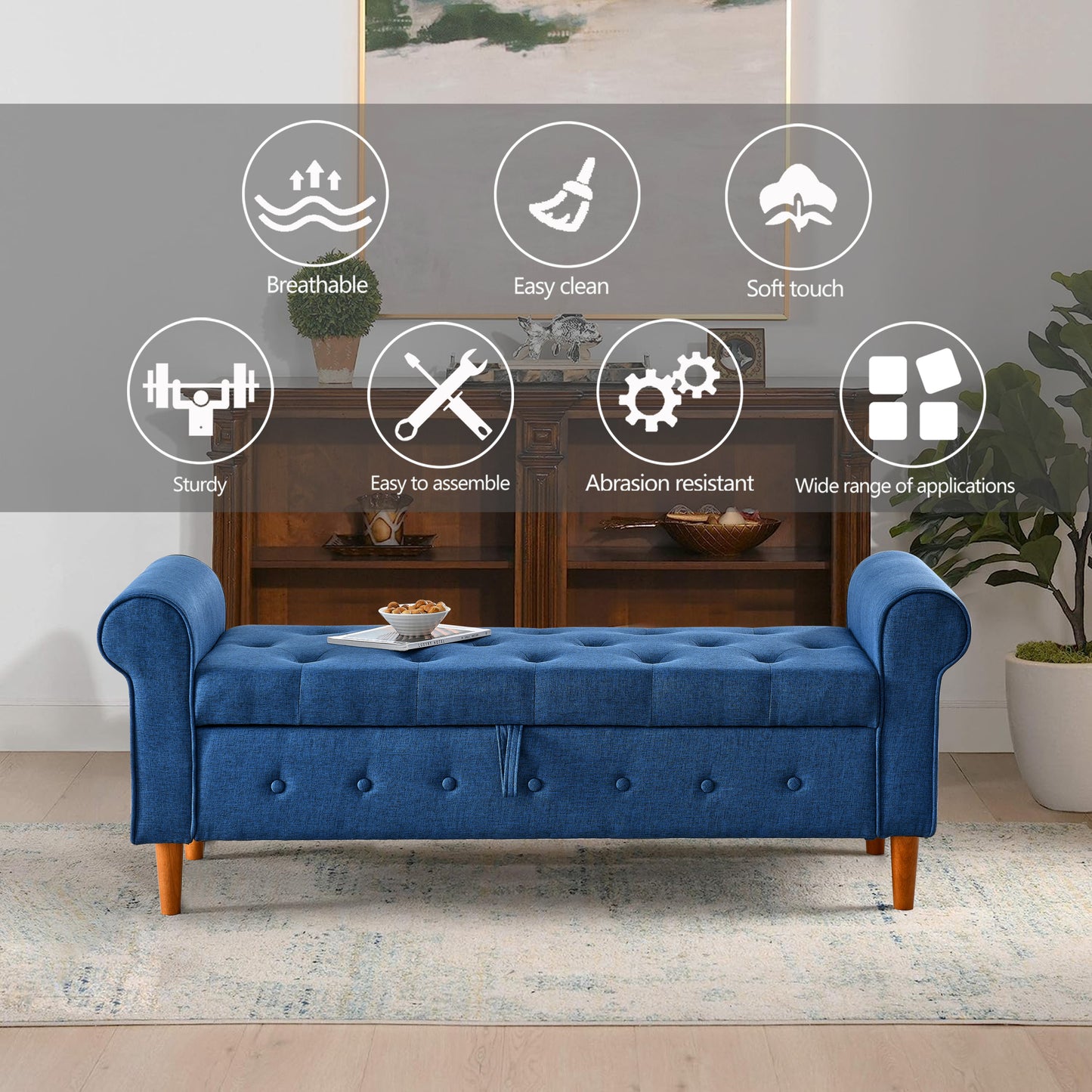 Tufted blue storage ottoman with rolled arms and wooden legs