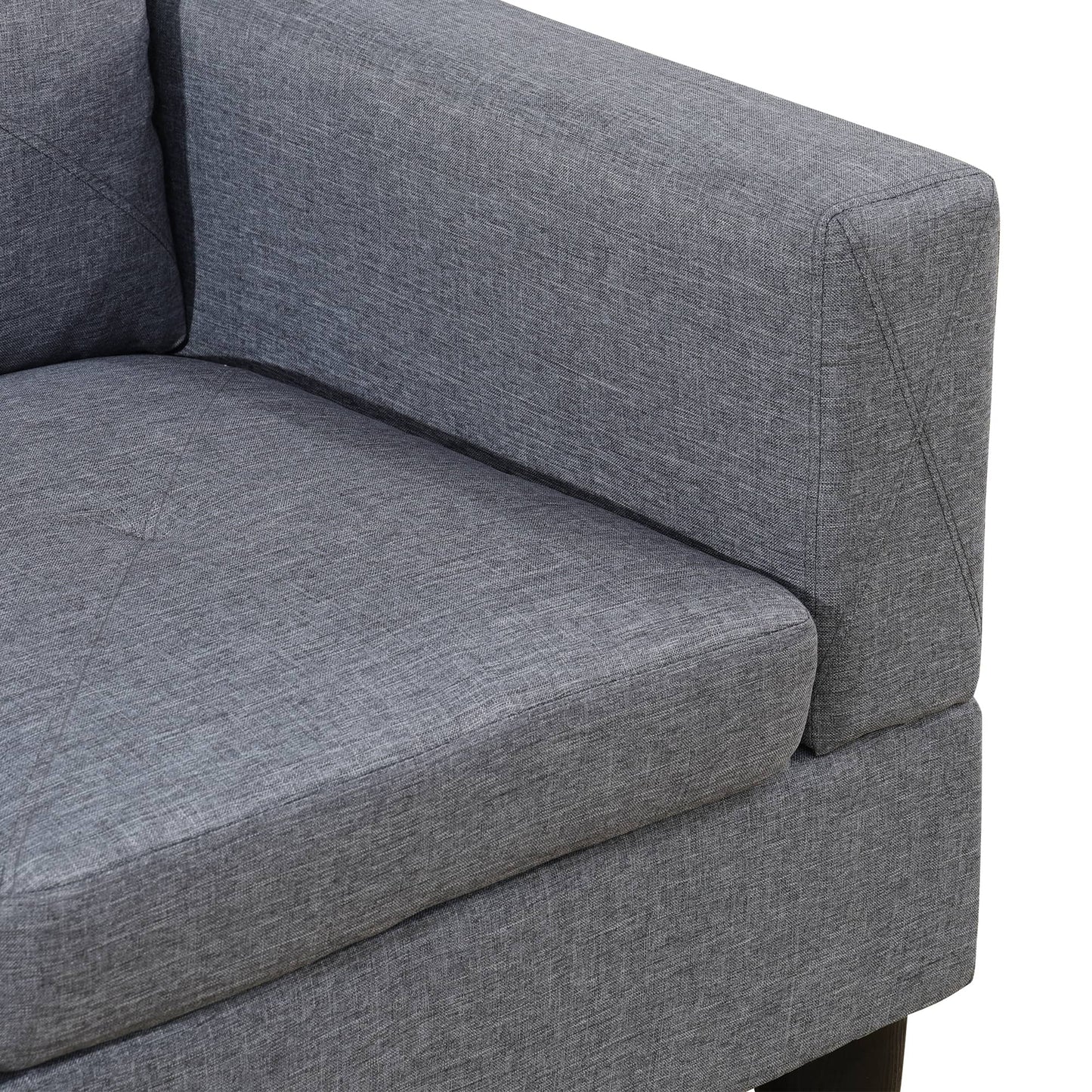Closeup of a grey fabric sofa armrest with textured weave detail