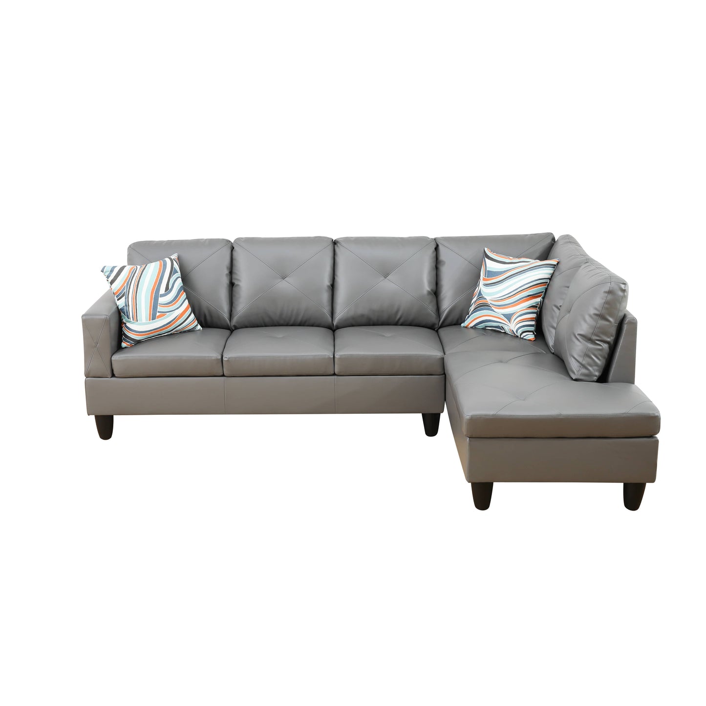Gray faux leather sectional sofa with diamond tufting and colorful throw pillows