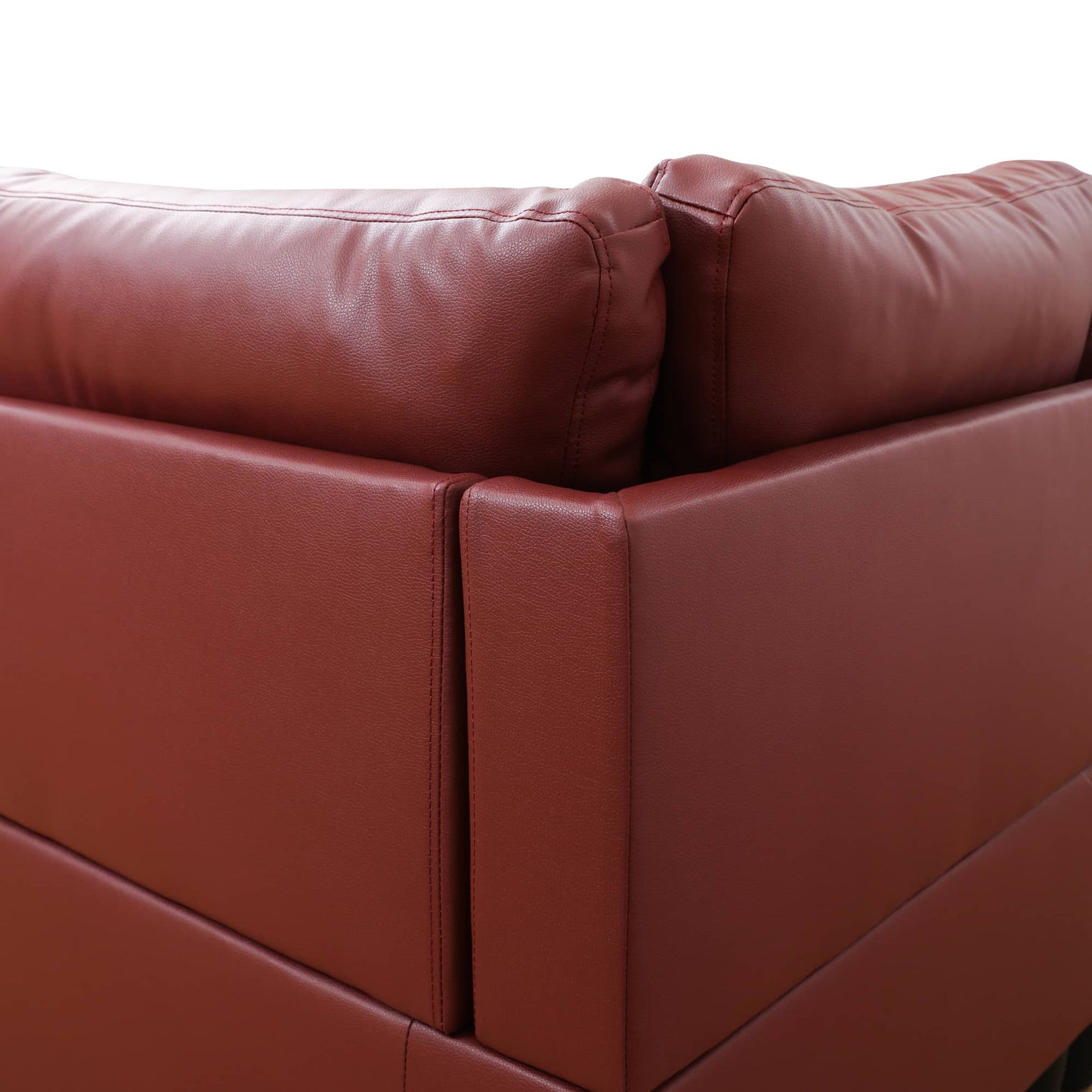 Red leather sectional sofa corner with stitched details