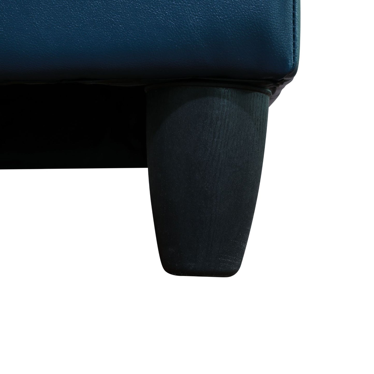 Navy blue leather sofa corner with dark wood leg