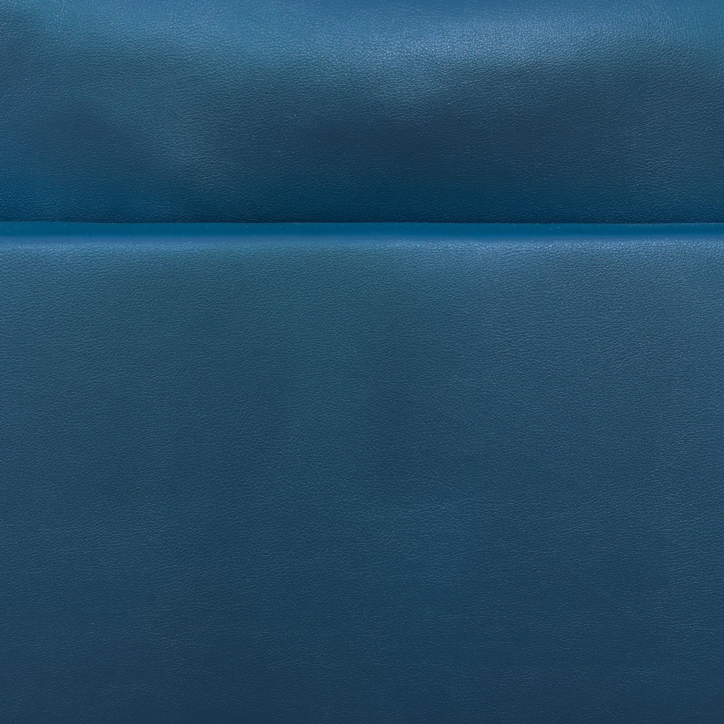 Closeup of textured navy blue leather upholstery