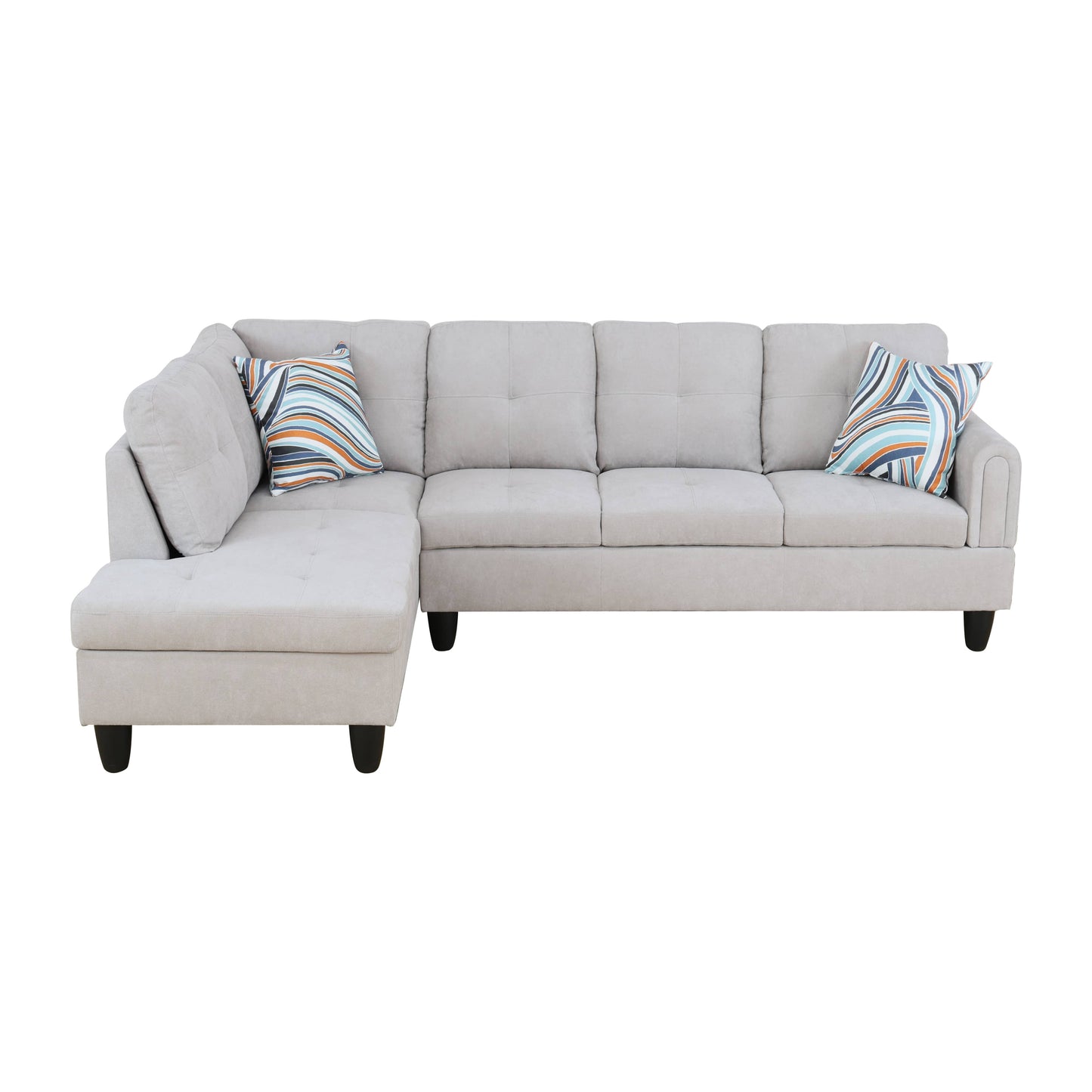 Beige upholstered Lshaped sectional sofa with tufted cushions and geometric patterned throw pillows