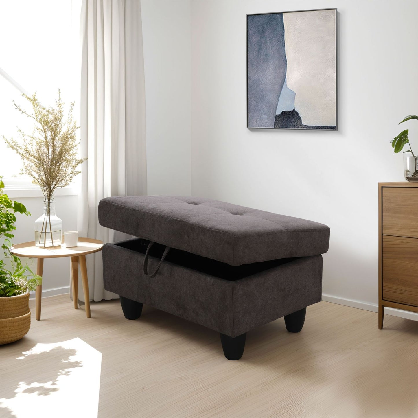 Dark grey fabric storage ottoman with tufted top