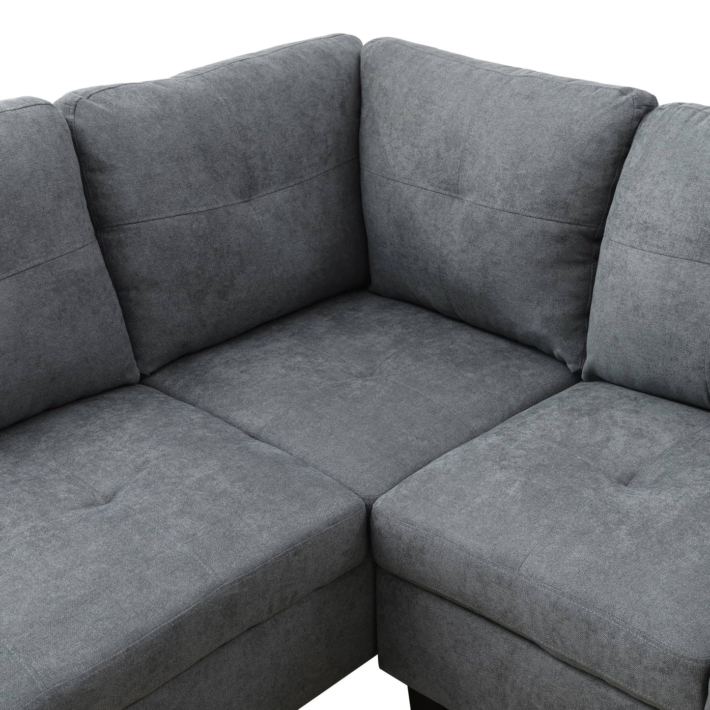 Dark gray fabric sectional sofa with plush cushions and tufted seats