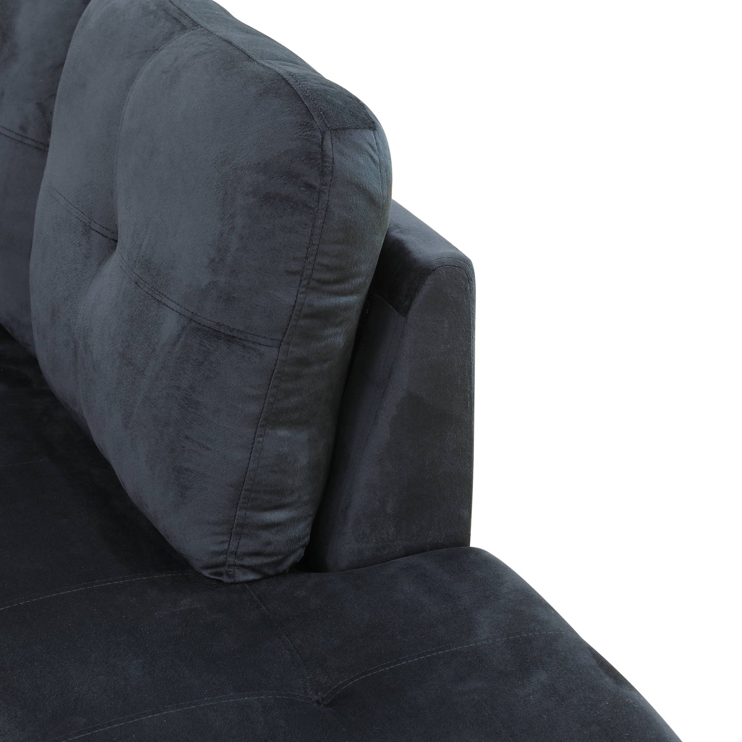 Dark grey velvet sofa detail with tufted back cushion and stitched seams