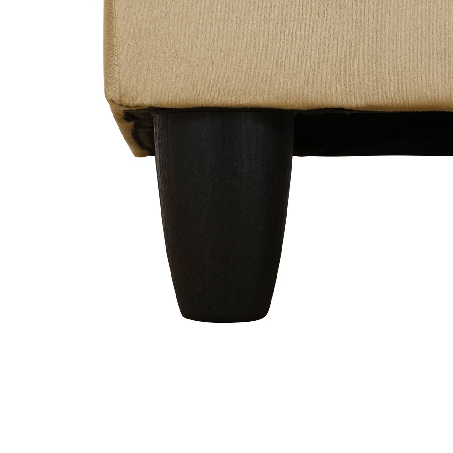 Beige textured fabric sofa corner with a tapered black wooden leg