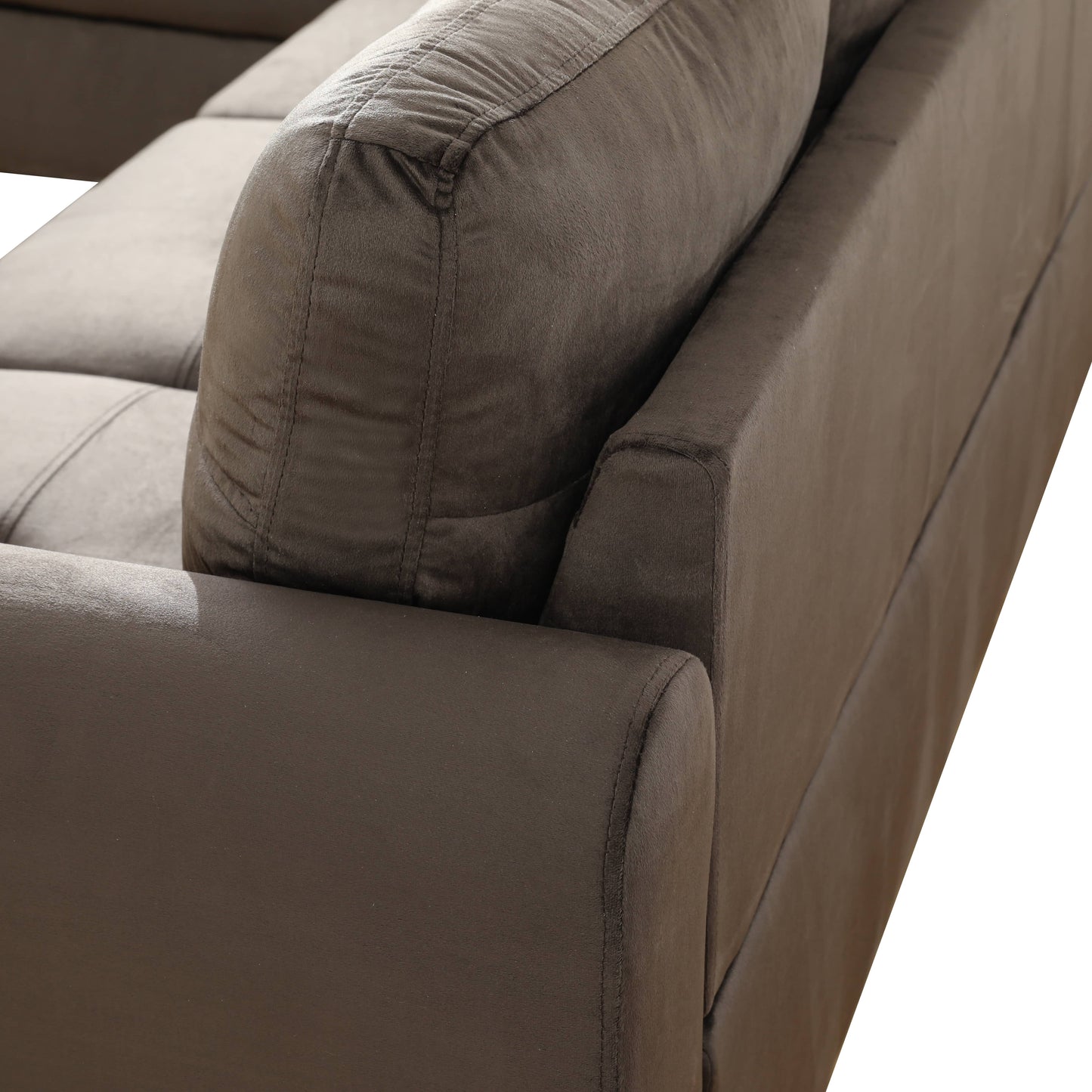 Dark brown plush fabric sofa corner detail