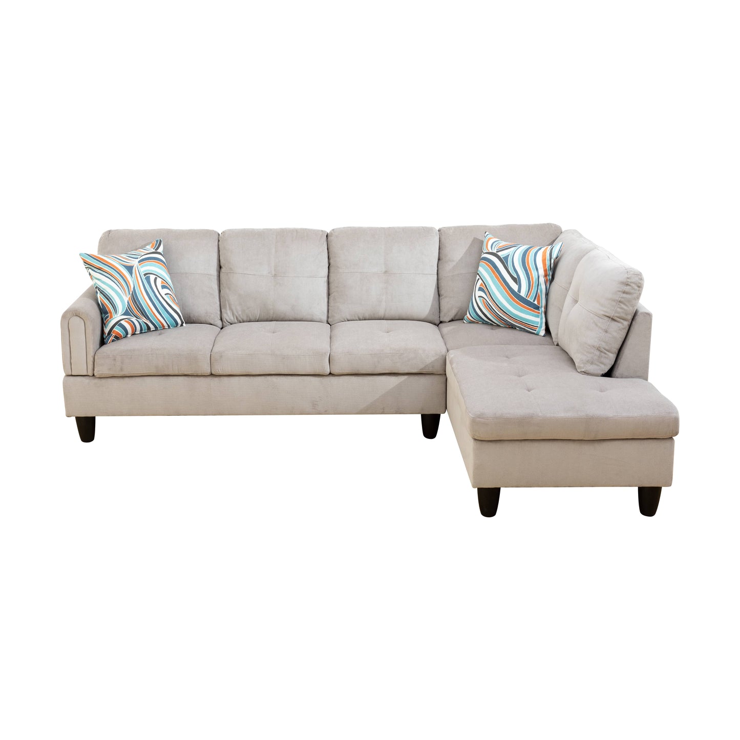 Light gray sectional sofa with plush cushions and abstract patterned throw pillows