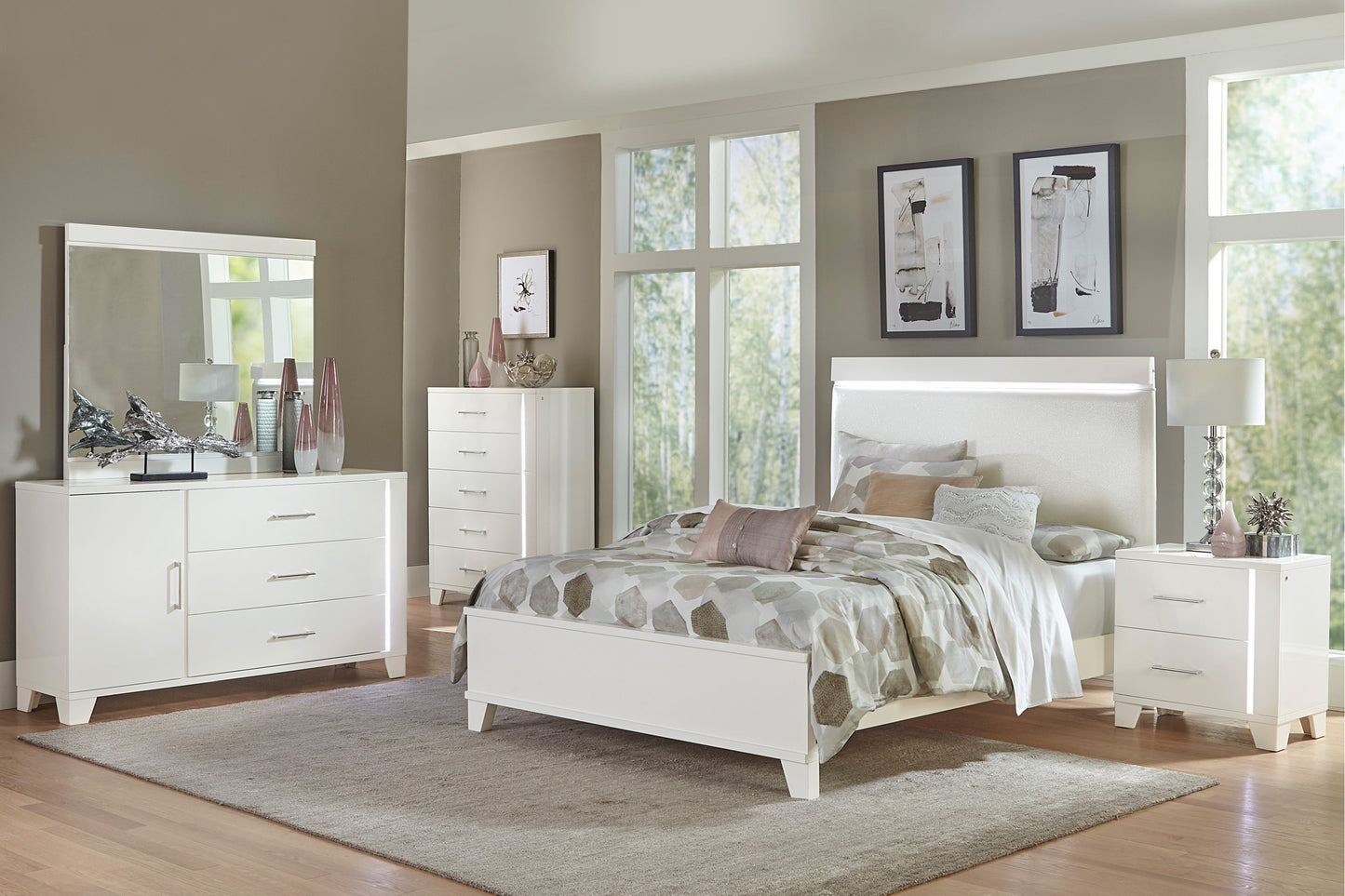 White upholstered queen bed with LED headboard and geometric pattern bedding
