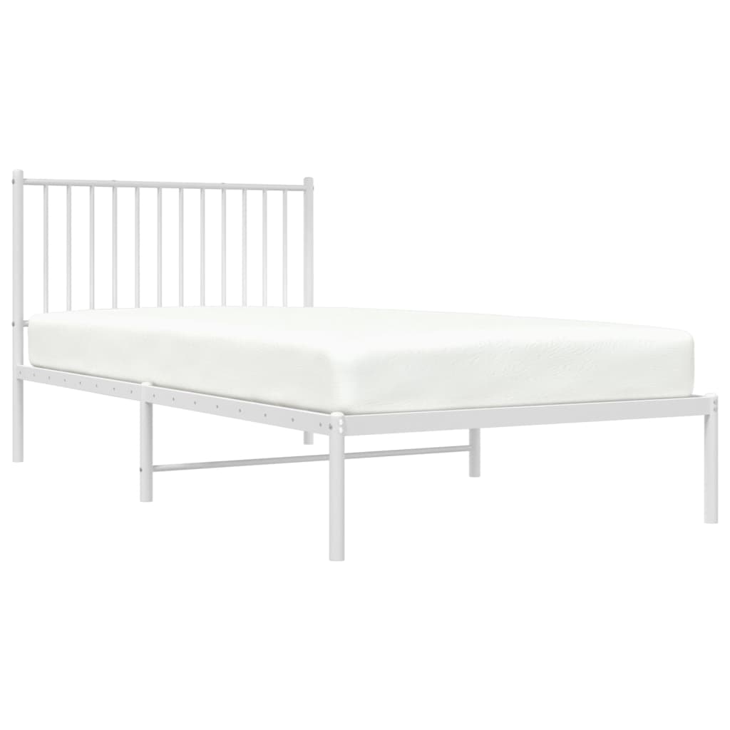 White metal twin bed frame with vertical slats on headboard