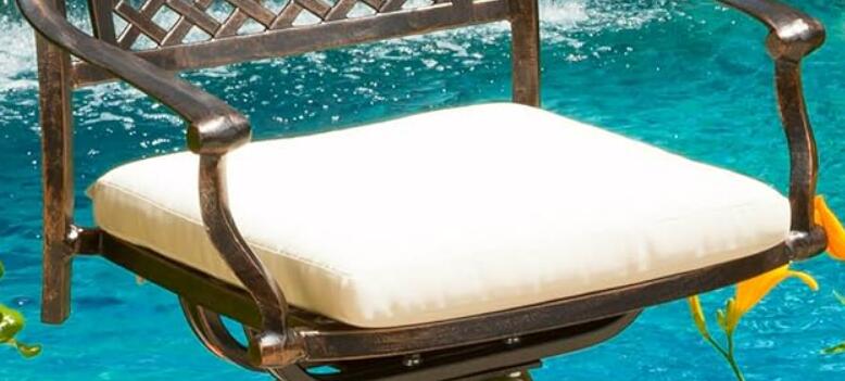 Bronze metal patio swivel chair with cream cushion
