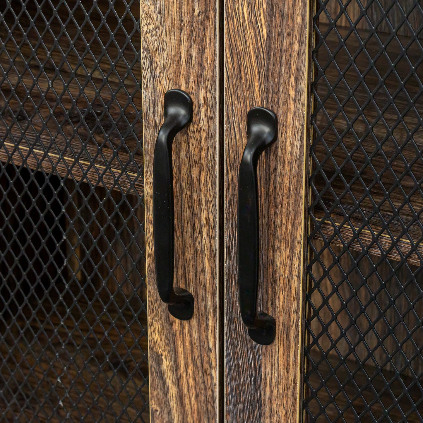 Rustic brown wood cabinet doors with black mesh and curved handles