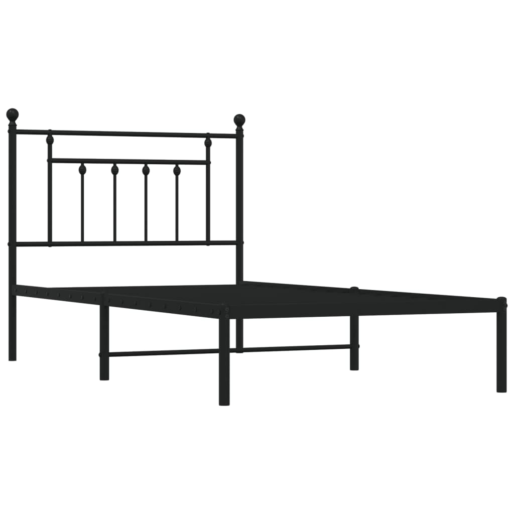 Black metal twin bed frame with a decorative headboard and mattress