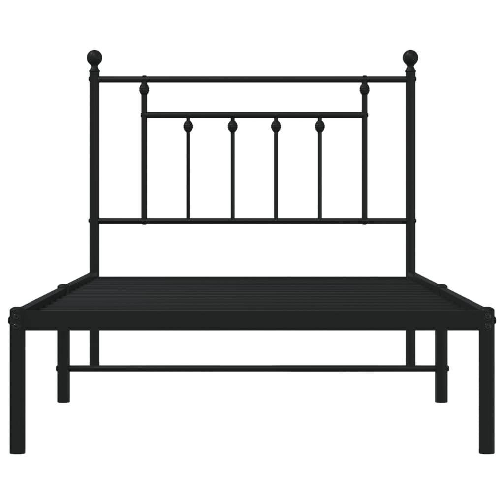 Black metal bed frame with a white mattress and a simple headboard design