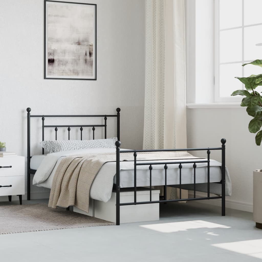 Black metal twin bed frame with rounded finials