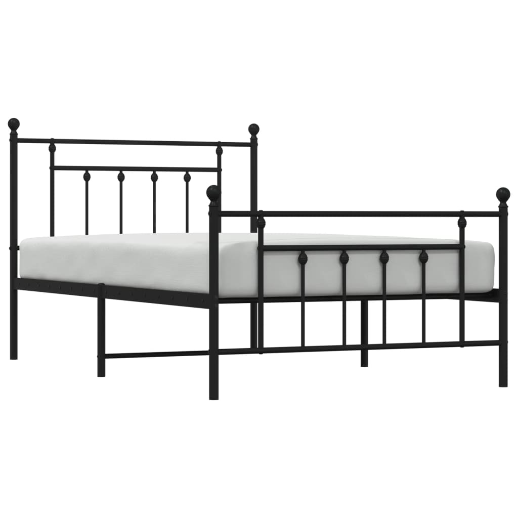 Dark bronze metal bed frame with ornamental details and a patterned comforter