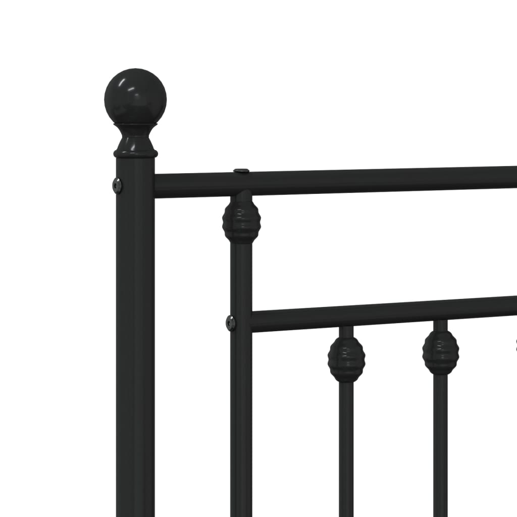 Black metal bed frame with ornate finials and slatted support