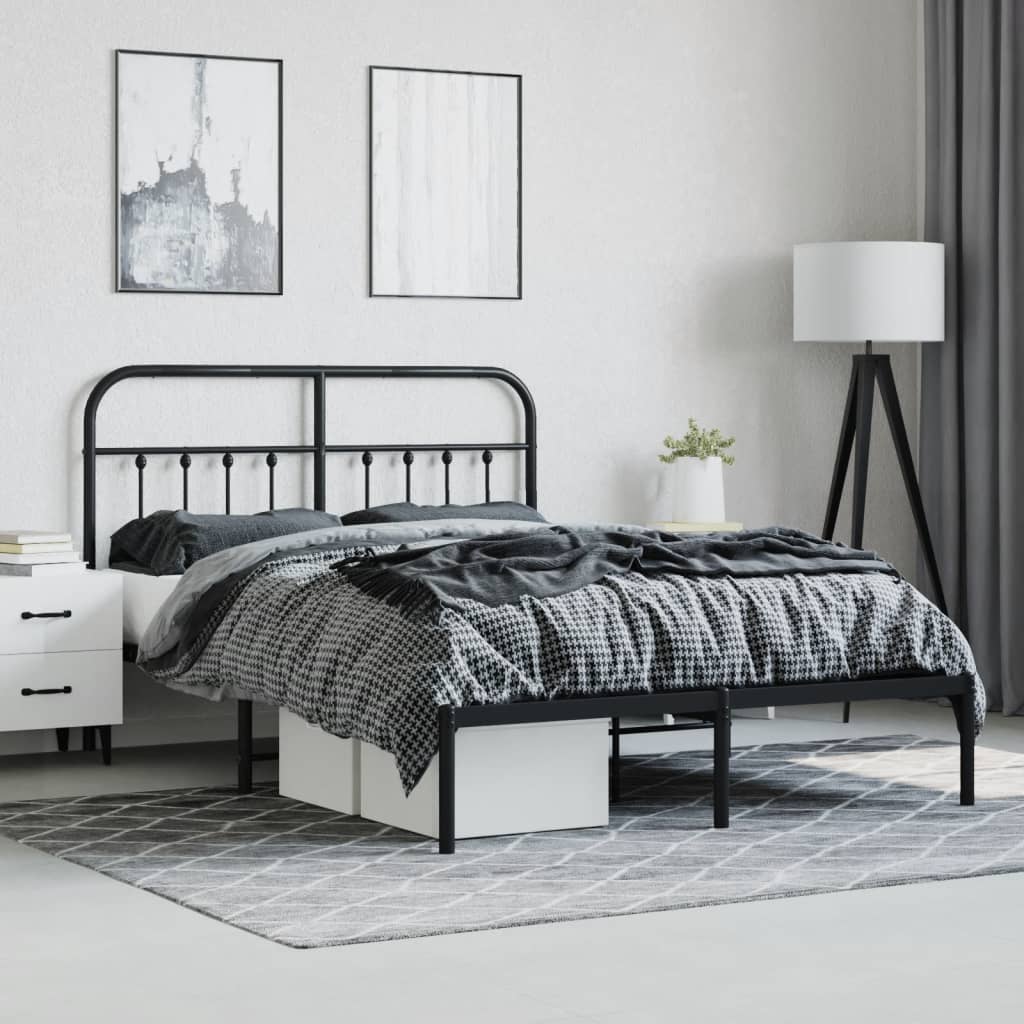 Black metal queen bed frame with arched headboard and footboard