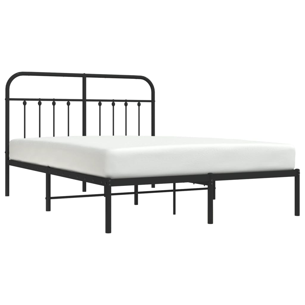 Black metal bed frame with a decorative headboard and platform support