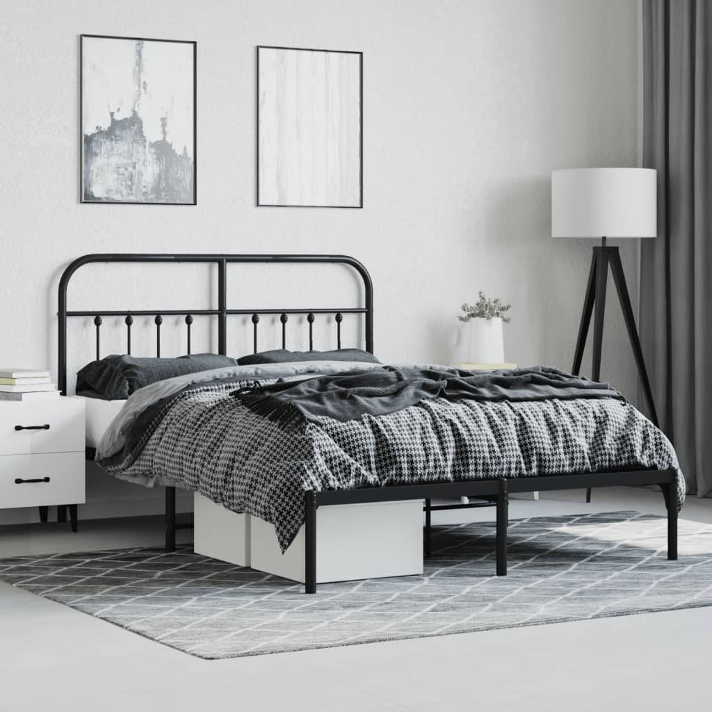 Dark gray metal bed frame with a curved headboard and footboard featuring decorative spindles