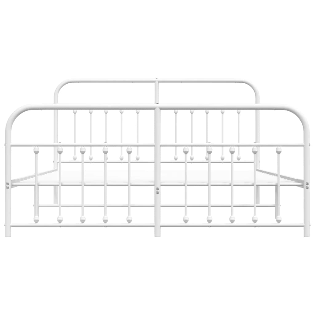 White metal bed frame with a curved headboard and footboard and a mattress