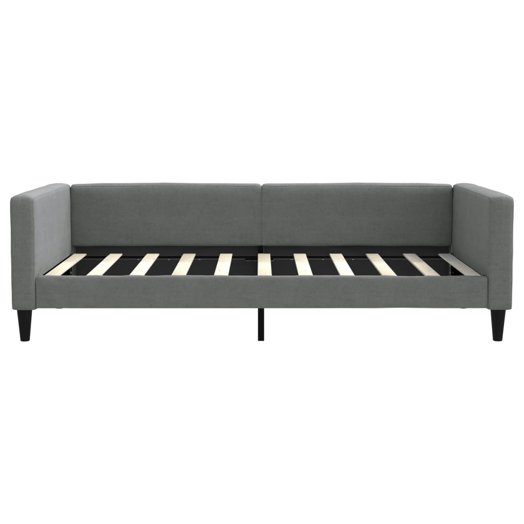 Gray upholstered daybed with wooden slats and black tapered legs