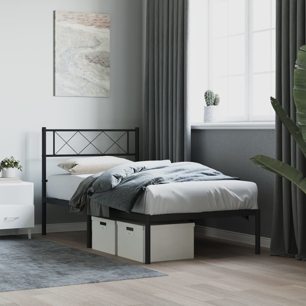Black metal twin bed frame with decorative crisscross headboard