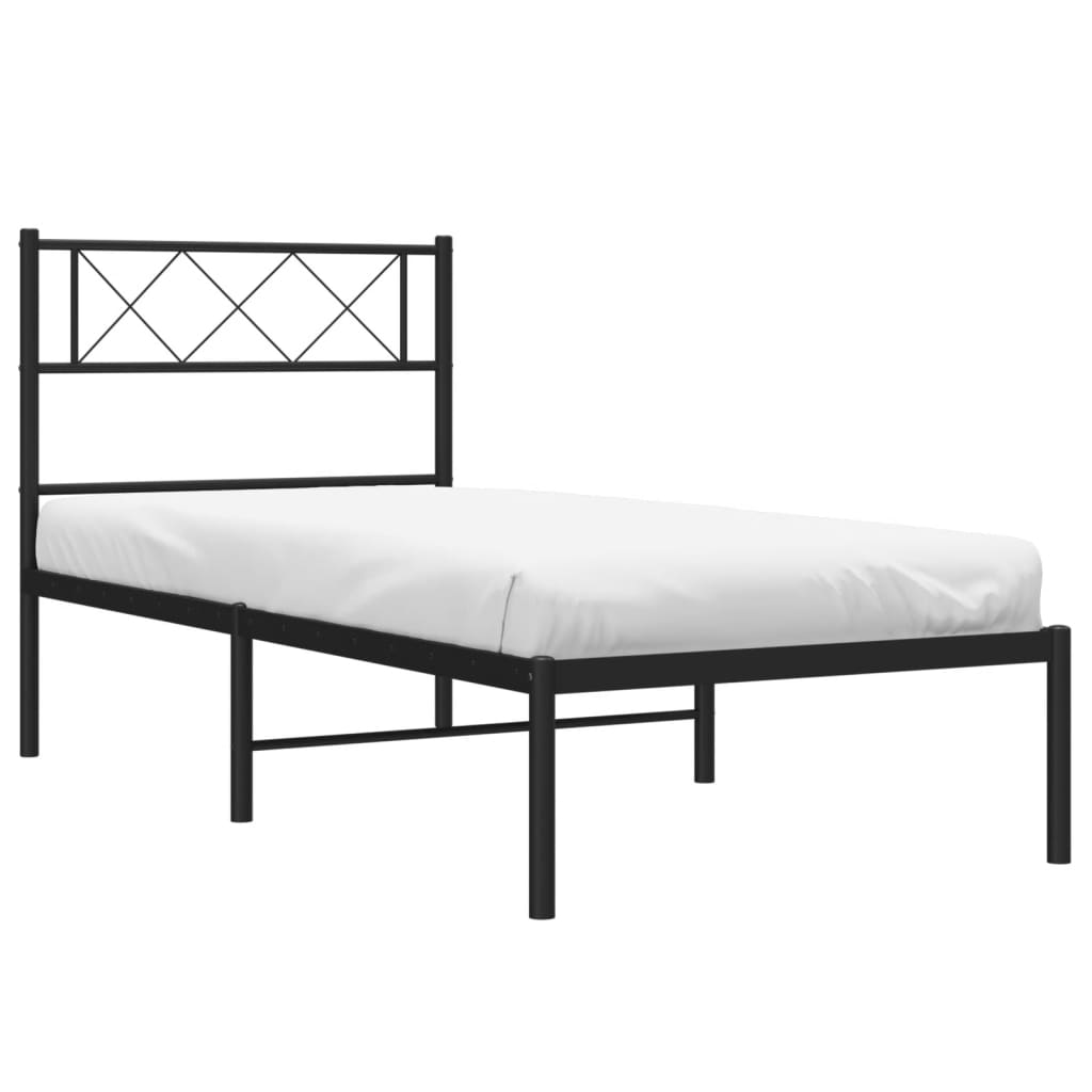 Black metal twin bed frame with geometric headboard and white mattress
