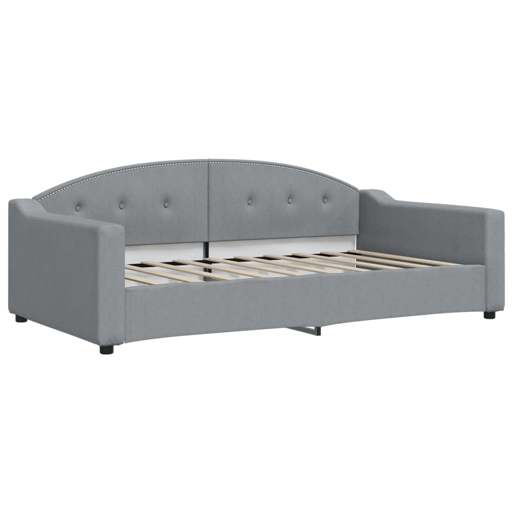 Gray faux leather upholstered daybed from the back with a curved headboard
