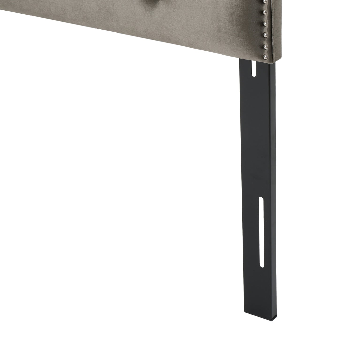 Tufted grey velvet headboard with decorative nailhead trim and black metal leg